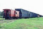 Texas Oklahoma & Eastern bay window caboose #84 on woodchip train.